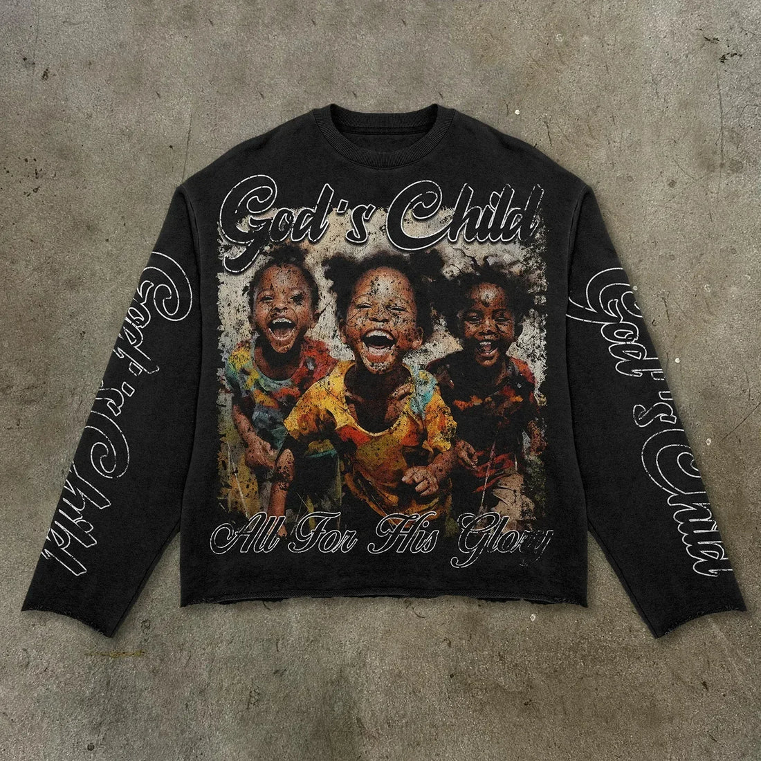 Black long-sleeve shirt with graphic of three children and text 'God's Child All For This Glory' on a white background