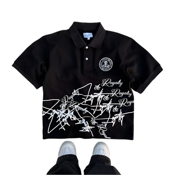 Black polo shirt with white text and logo on a concrete floor