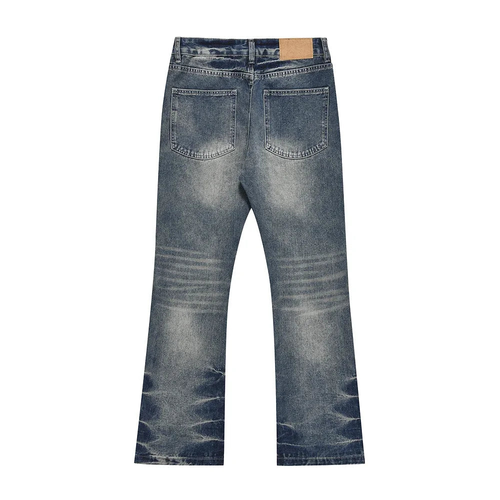 Blue jeans with 'UCREBEL' branding on a white background