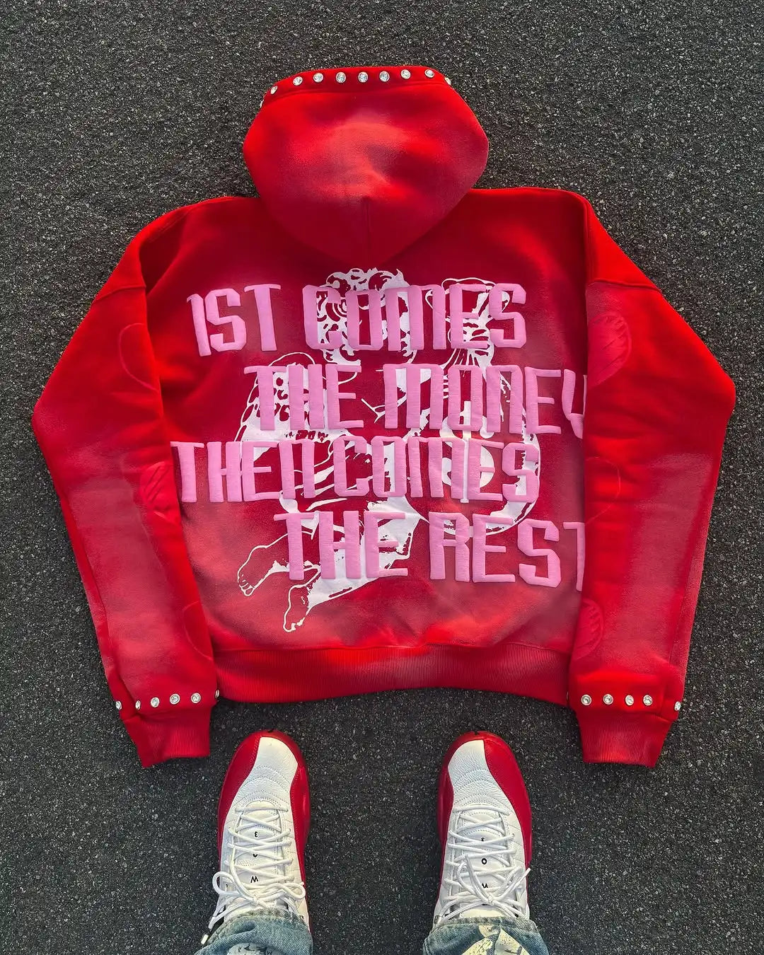 Red transparent hoodie with a logo on a dark surface
